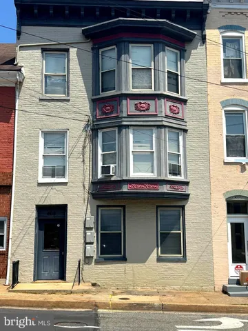 a view of building with glass windows