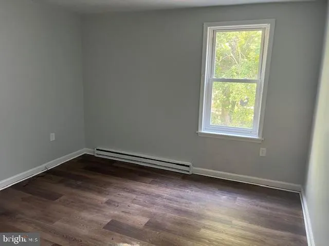 a kitchen with granite countertop cabinets and white appliances
