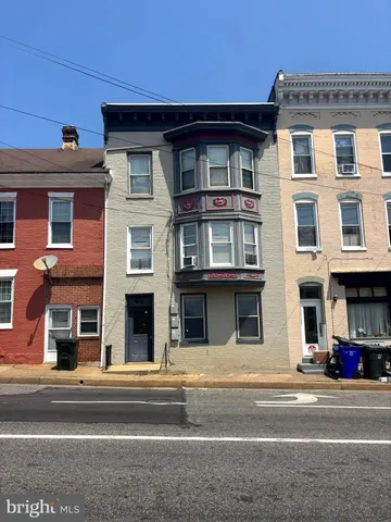 a view of a building with a street