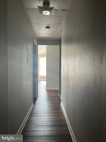 a white toilet sitting next to a bath tub