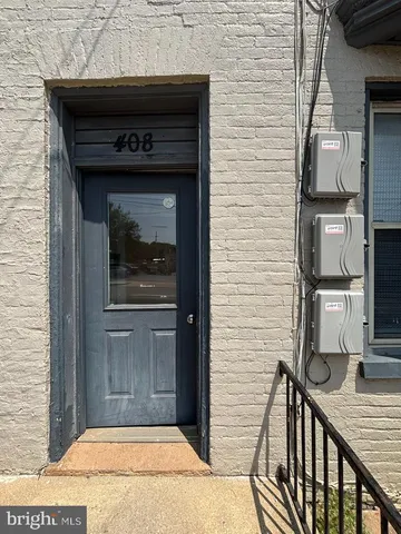 a sign on a brick wall