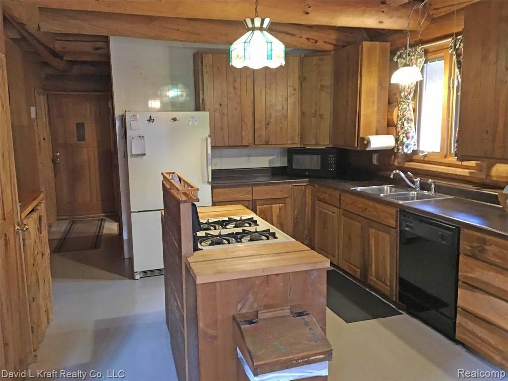 6732 Champagne Road Kinde, MI 48445 - Photo 6 of 24 6732ChampagneKitchen.jpg