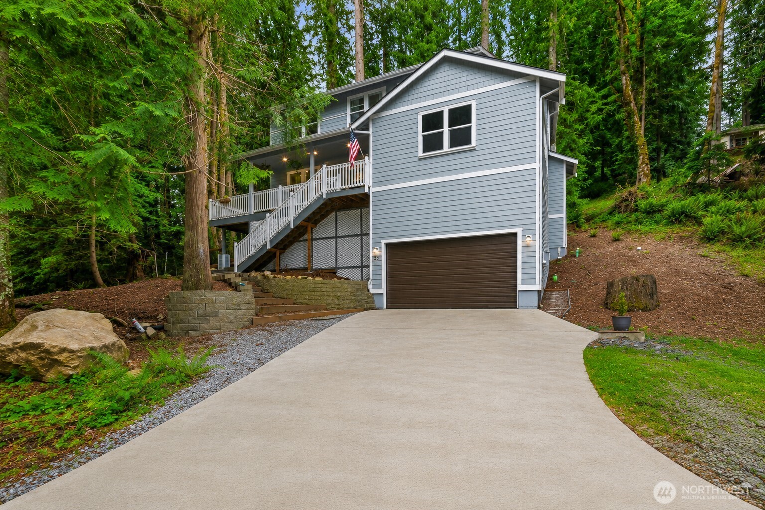 23 Spring Court Bellingham, WA 98229 - Photo 35 of 38 a front view of a house with a yard and garage