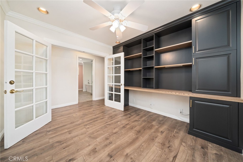 1721 East Ruddock Street Covina, CA 91724 - Photo 15 of 39 a view of an empty room with a window and wooden floor
