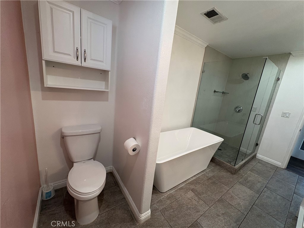 1721 East Ruddock Street Covina, CA 91724 - Photo 16 of 29 a bathroom with a toilet and a sink