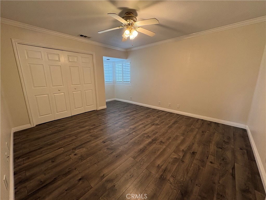 1721 East Ruddock Street Covina, CA 91724 - Photo 20 of 29 an empty room with wooden floor closet and windows