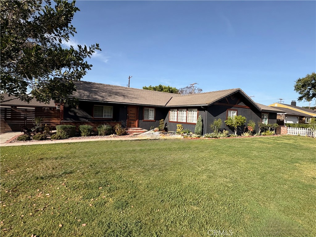 1721 East Ruddock Street Covina, CA 91724 - Photo 2 of 29 a front view of a house with a garden