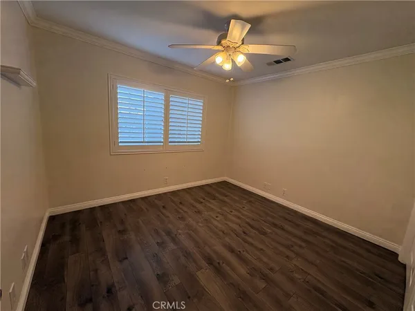 a bedroom with a bed and a walk in closet