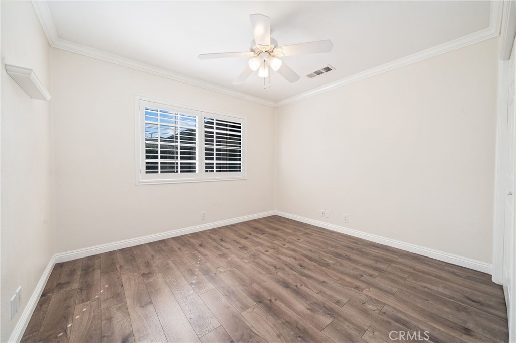 1721 East Ruddock Street Covina, CA 91724 - Photo 21 of 39 a view of an empty room with wooden floor and a window