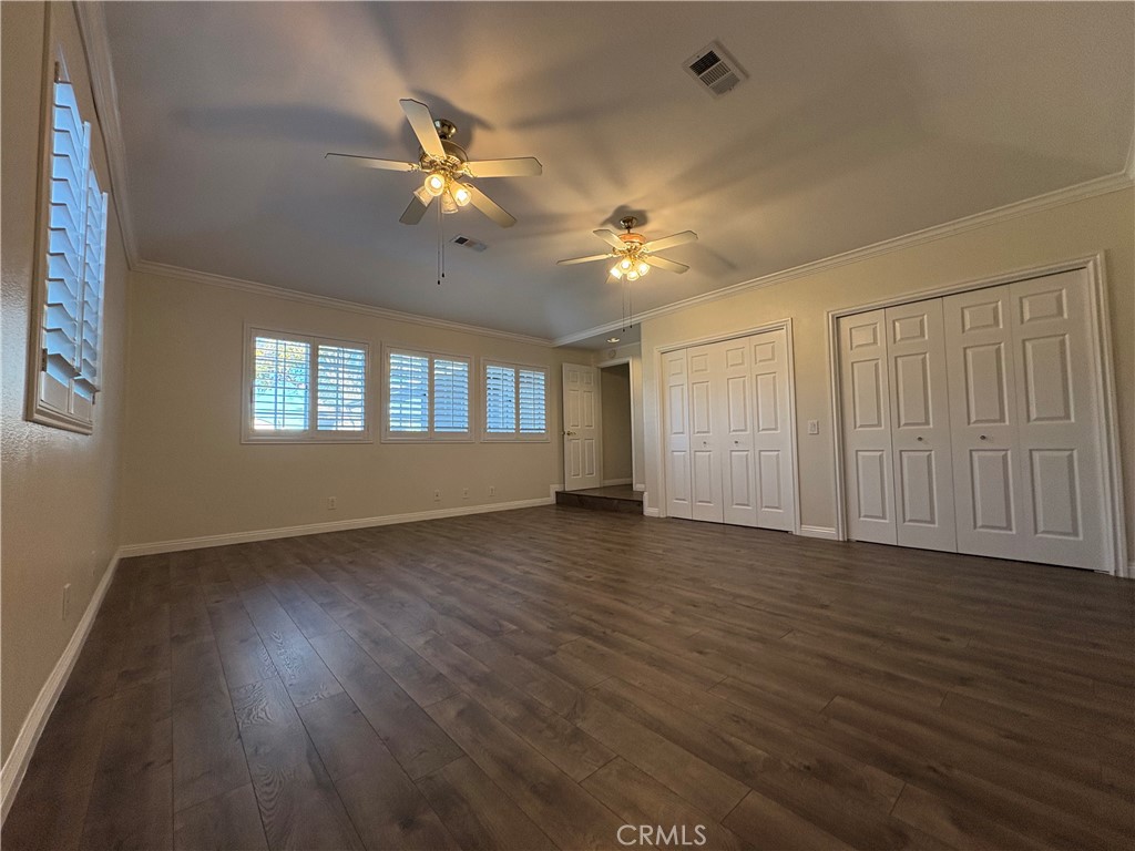 1721 East Ruddock Street Covina, CA 91724 - Photo 22 of 29 a view of an empty room with a window and wooden floor