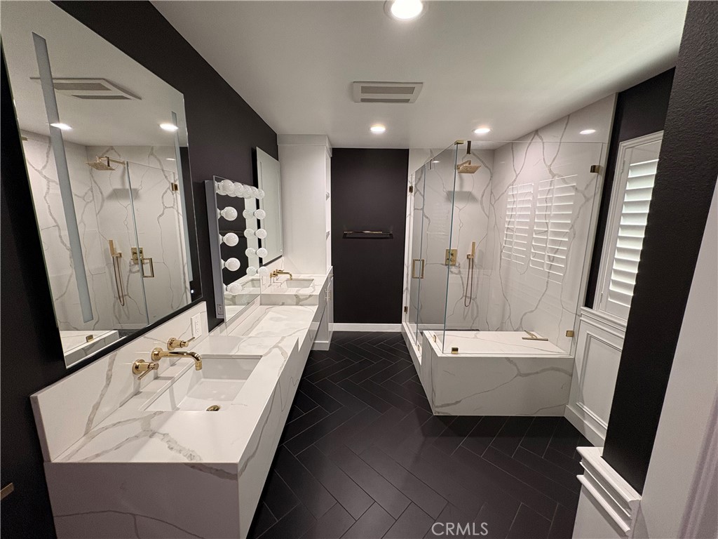 1721 East Ruddock Street Covina, CA 91724 - Photo 25 of 29 a bathroom with a bathtub sink and mirror