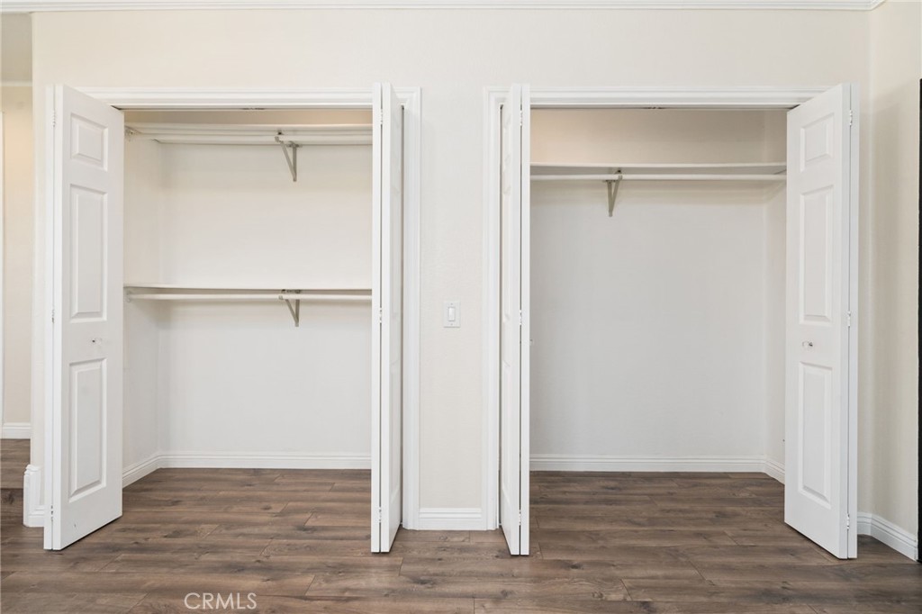 1721 East Ruddock Street Covina, CA 91724 - Photo 25 of 39 a view of an empty walk in closet with wooden floor