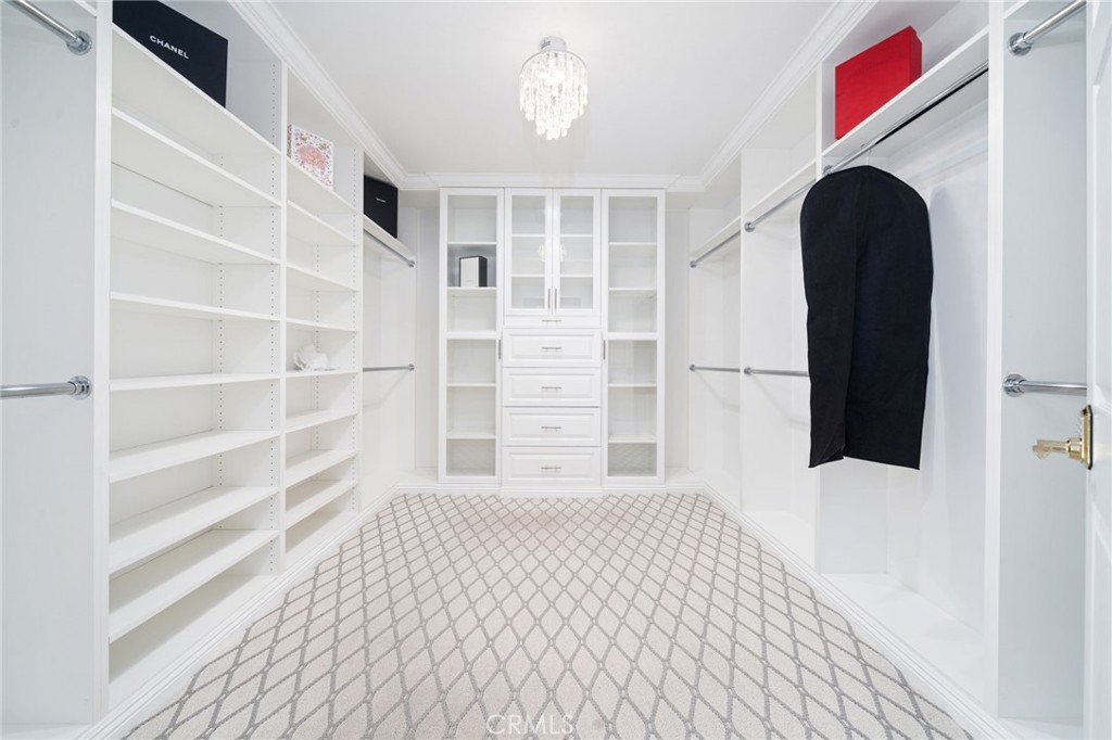 1721 East Ruddock Street Covina, CA 91724 - Photo 26 of 39 a view of walk in closet with empty racks