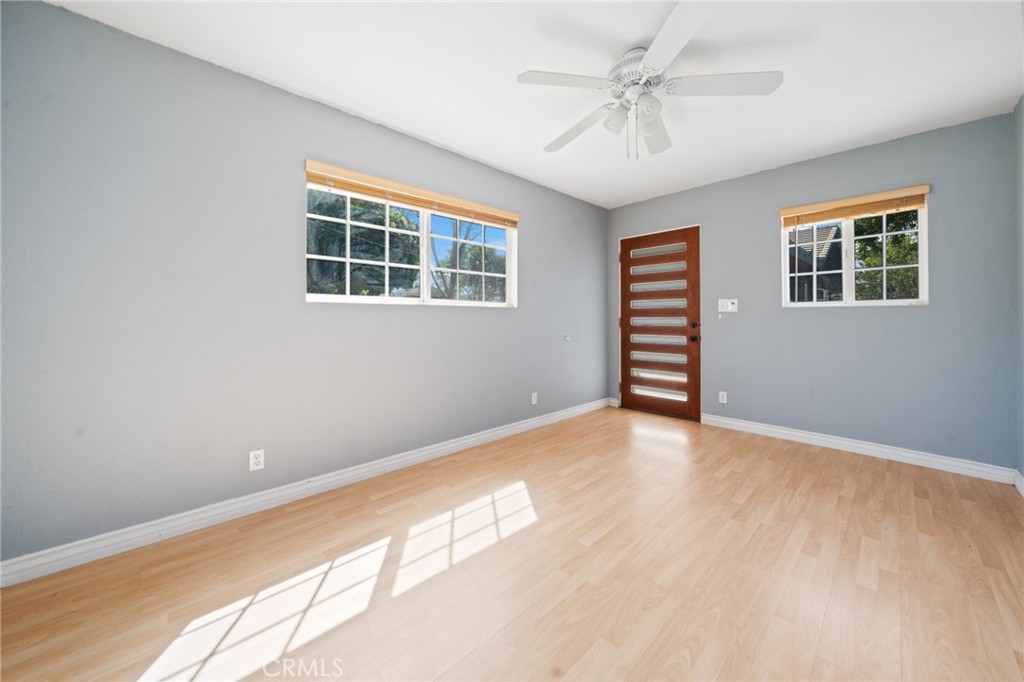 1721 East Ruddock Street Covina, CA 91724 - Photo 31 of 39 a view of an empty room with a window and wooden floor