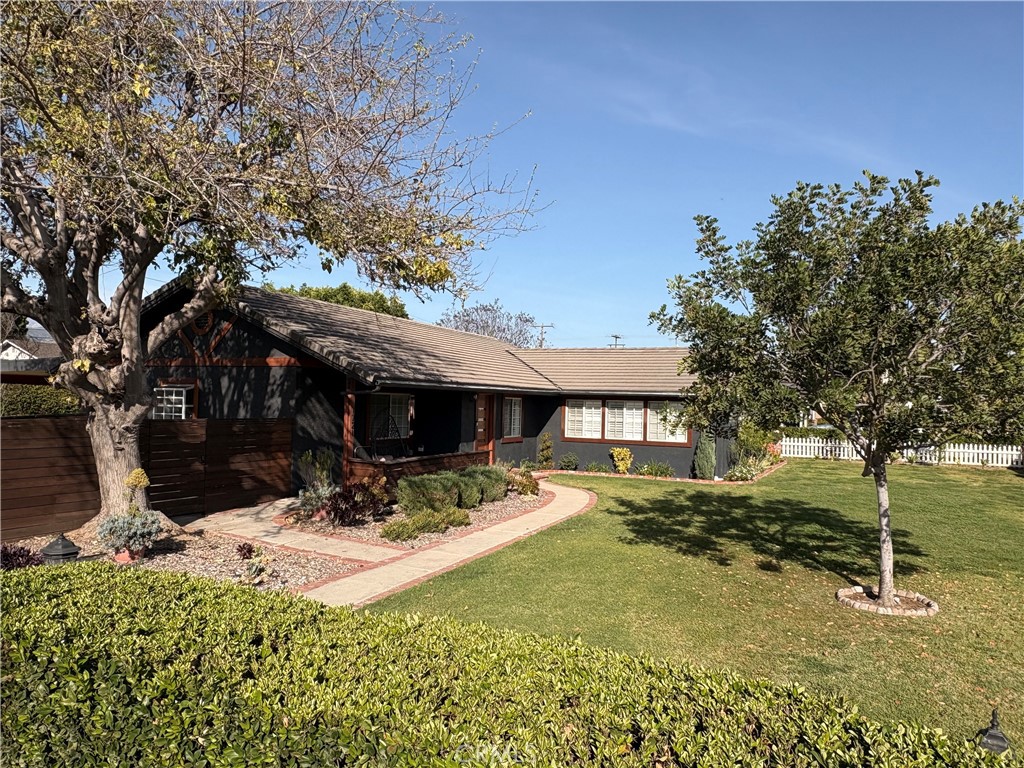 1721 East Ruddock Street Covina, CA 91724 - Photo 5 of 29 a view of a house with backyard and tree