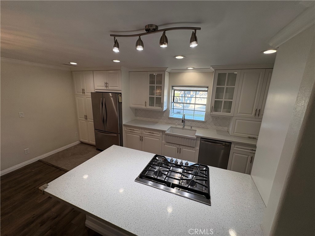 1721 East Ruddock Street Covina, CA 91724 - Photo 8 of 29 a kitchen with refrigerator and window