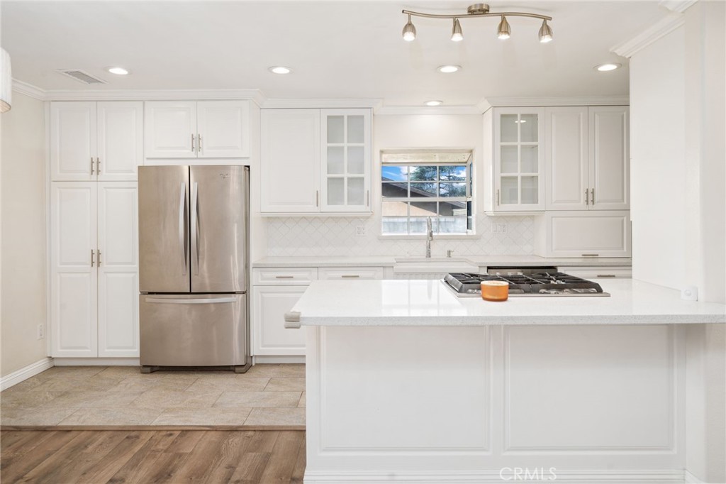 1721 East Ruddock Street Covina, CA 91724 - Photo 8 of 39 a kitchen with stainless steel appliances granite countertop a refrigerator a sink and a stove