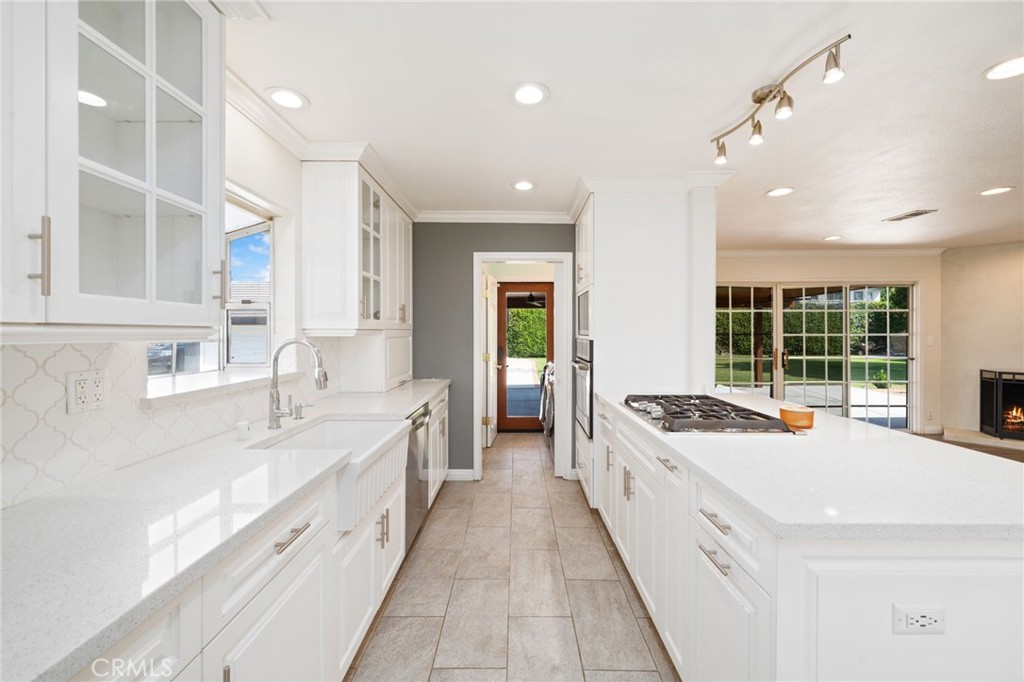 1721 East Ruddock Street Covina, CA 91724 - Photo 9 of 39 a large white kitchen with a large window