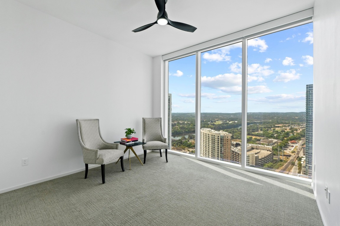 301 West Avenue, Unit 2708 Austin, TX 78701 - Photo 14 of 27 a living room with furniture and a large window