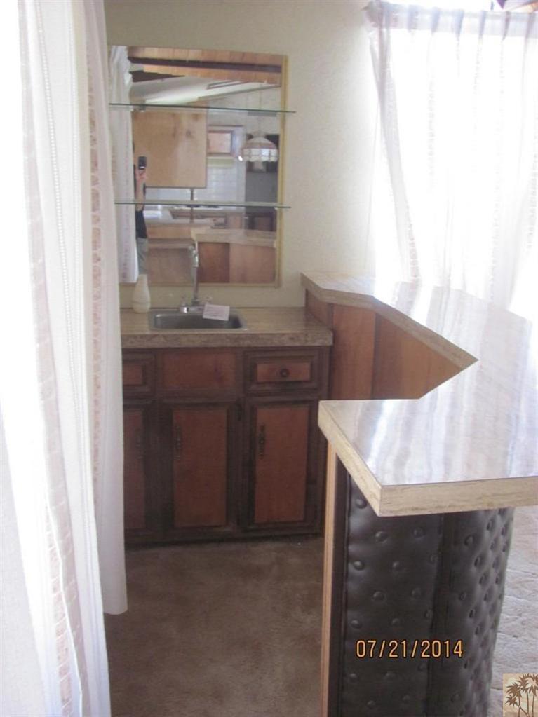 7180 Saddleback Road Joshua Tree, CA 92252 - Photo 11 of 20 a closeup of a sink with a cabinet
