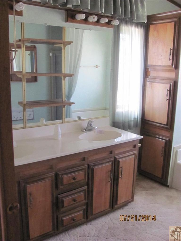 7180 Saddleback Road Joshua Tree, CA 92252 - Photo 15 of 20 a bathroom with a sink and a mirror