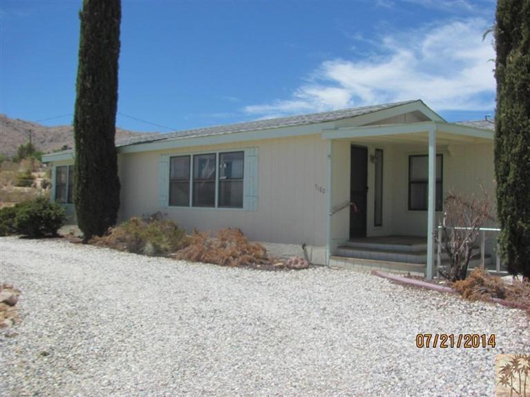 7180 Saddleback Road Joshua Tree, CA 92252 - Photo 3 of 20 a backyard of a house