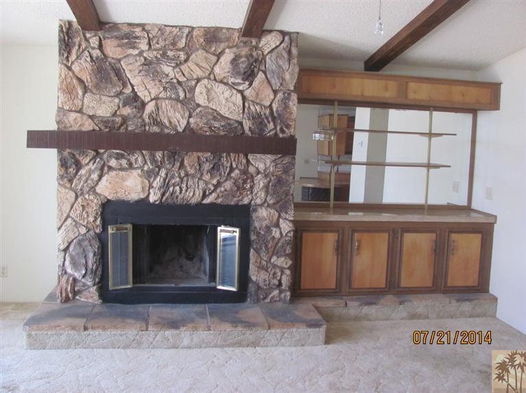 7180 Saddleback Road Joshua Tree, CA 92252 - Photo 5 of 20 a living room with a fireplace