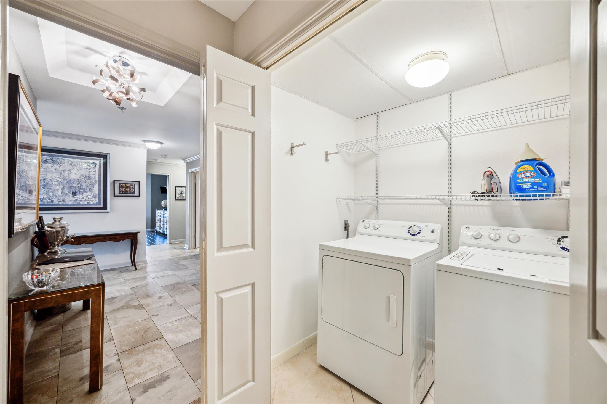3350 McCue Road, Unit 1504 Houston, TX 77056 - Photo 20 of 32 The utility room, located just off the entryway before the kitchen, includes shelving and full-size appliances for added convenience.