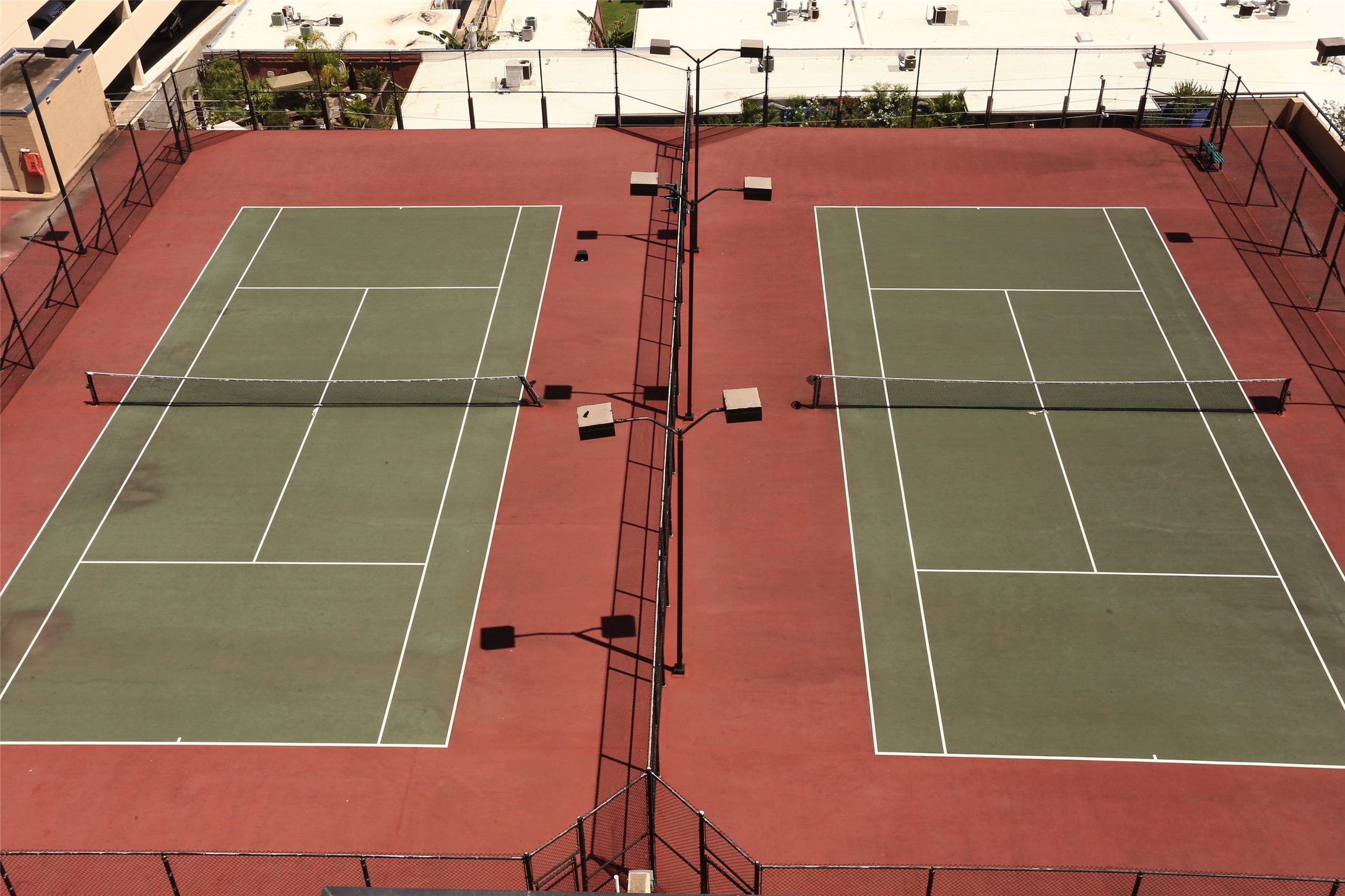 3350 McCue Road, Unit 1504 Houston, TX 77056 - Photo 30 of 32 Love tennis? Take advantage of the rooftop tennis courts located atop the parking garage—an unexpected perk in this vibrant urban setting.