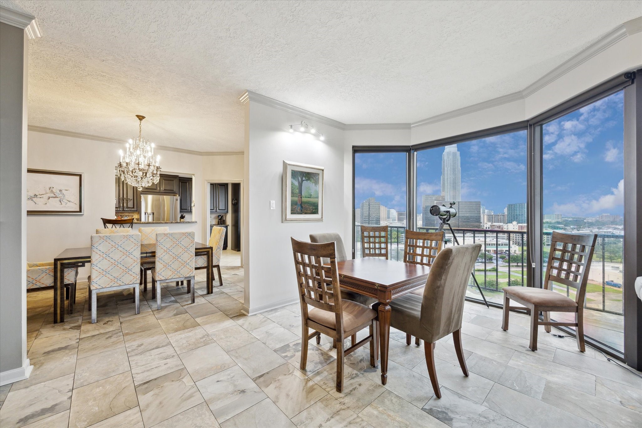 3350 McCue Road, Unit 1504 Houston, TX 77056 - Photo 7 of 32 An ideal spot for a breakfast nook, this area offers views of Uptown, enhanced by crown molding and ideally placed art lighting.