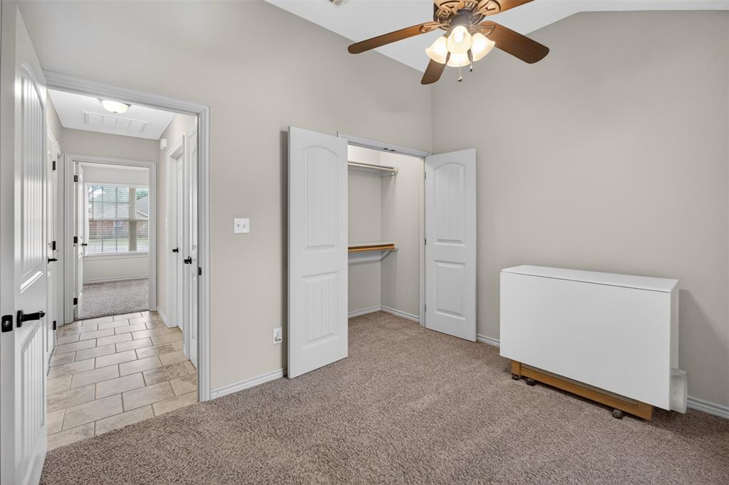 505 East 5th Street Springtown, TX 76082 - Photo 24 of 39 wooden floor in an empty room and a bathroom