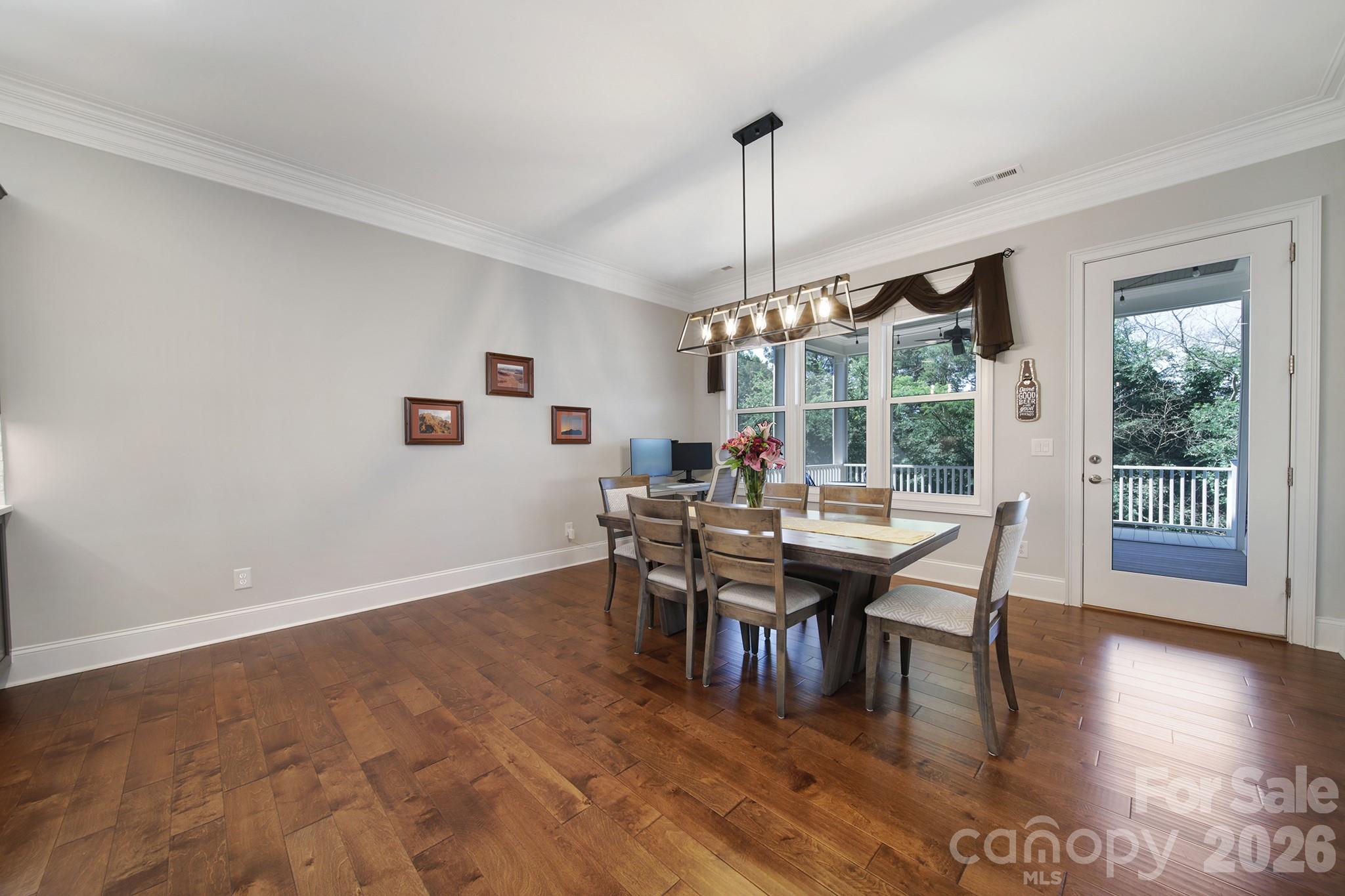 1633 Half Pint Loop Fort Mill, SC 29708 - Photo 14 of 48 a view of a dining room with furniture window and wooden floor