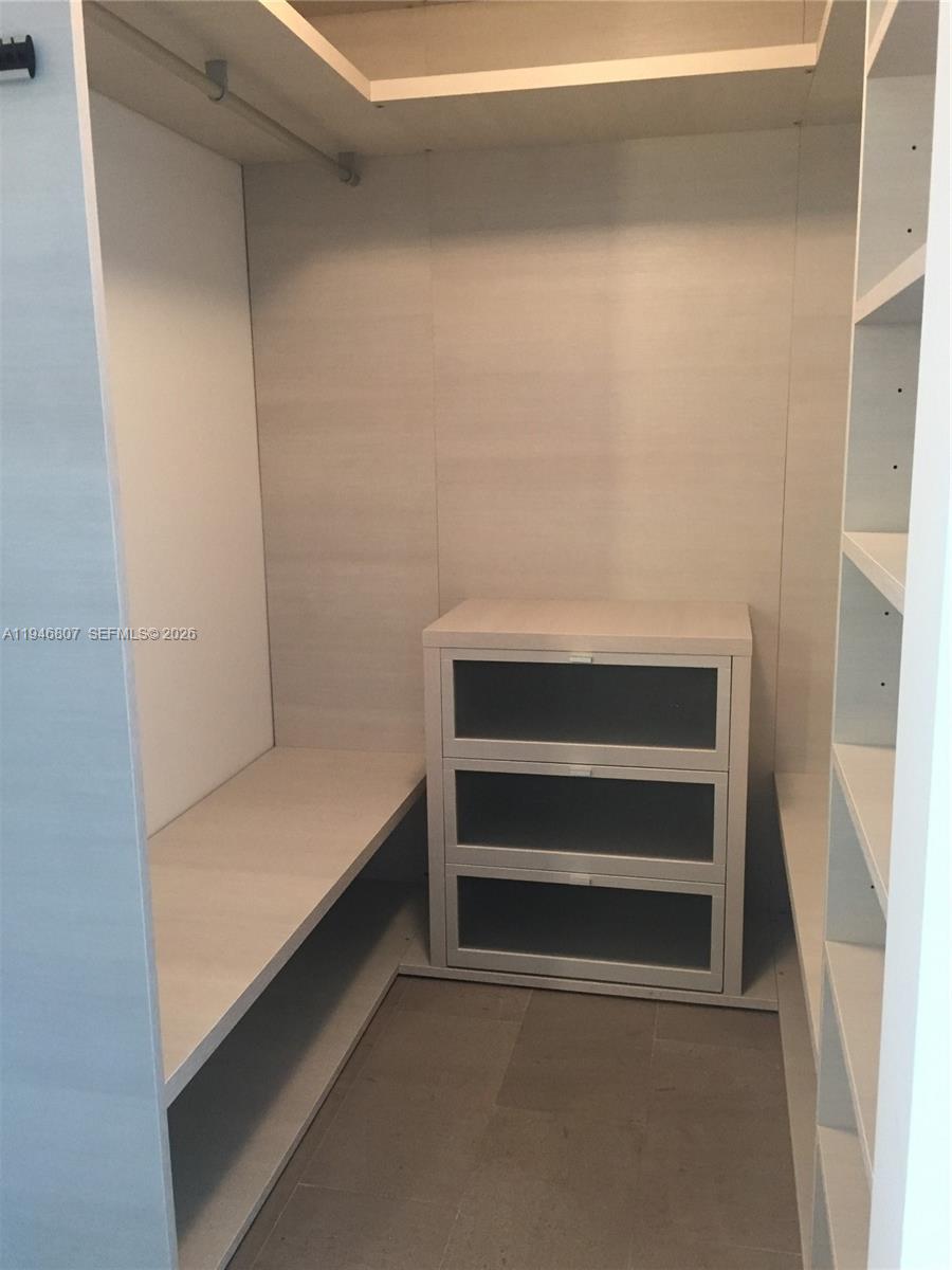 68 Southeast 6th Street, Unit 2504 Miami, FL 33131 - Photo 14 of 47 a view of walk in closet