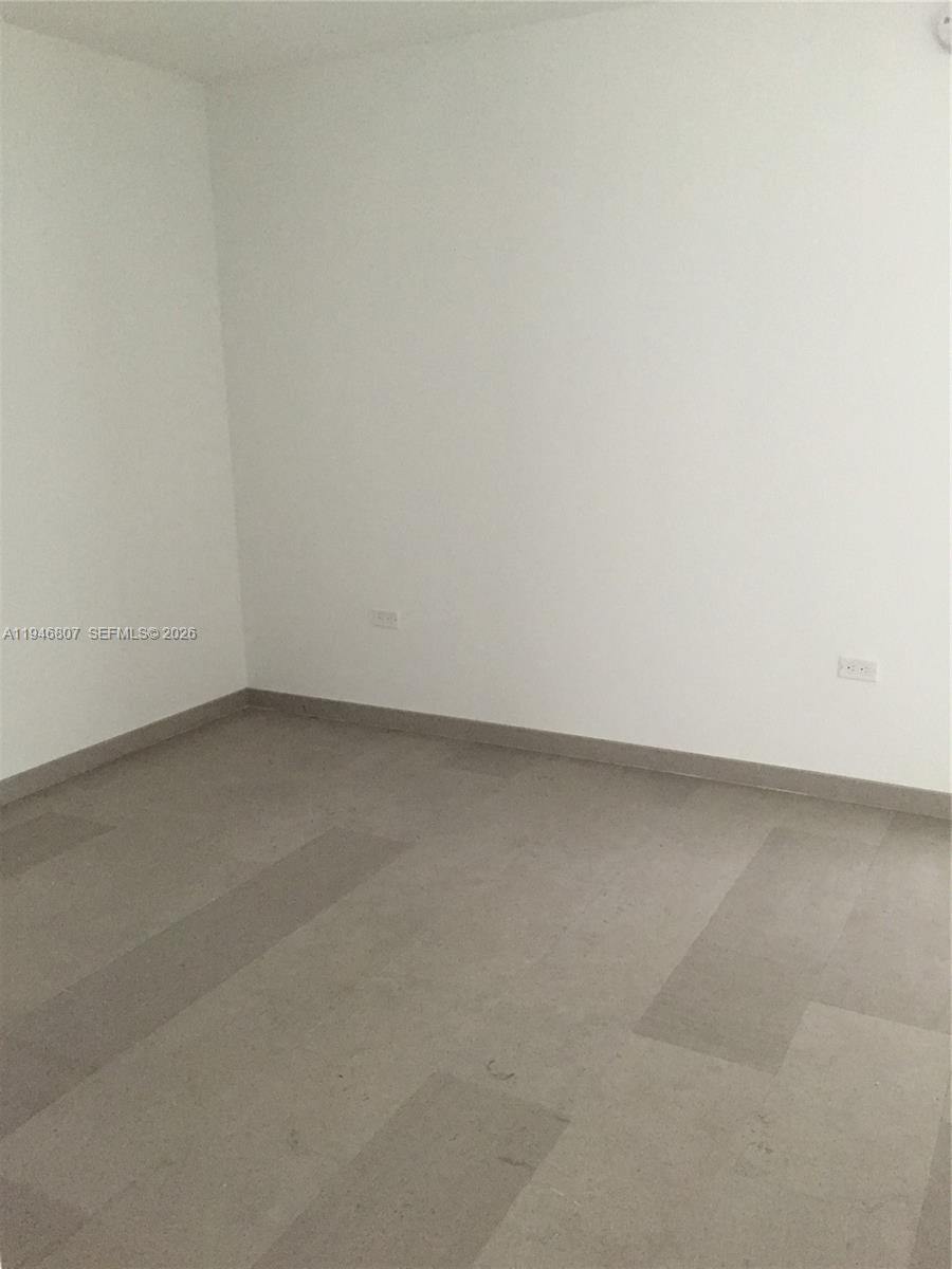 68 Southeast 6th Street, Unit 2504 Miami, FL 33131 - Photo 20 of 47 a view of an empty room