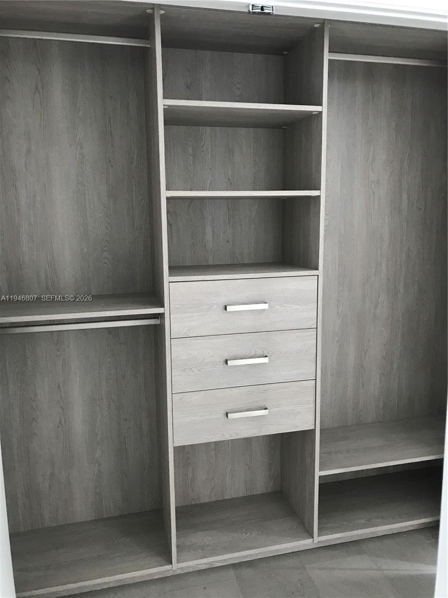 68 Southeast 6th Street, Unit 2504 Miami, FL 33131 - Photo 22 of 47 a close view of closet