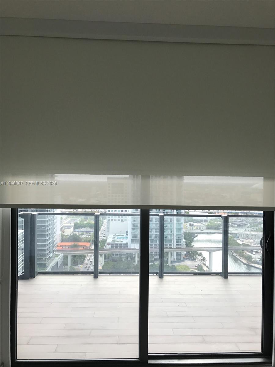 68 Southeast 6th Street, Unit 2504 Miami, FL 33131 - Photo 25 of 47 a view of empty room with floor to ceiling window