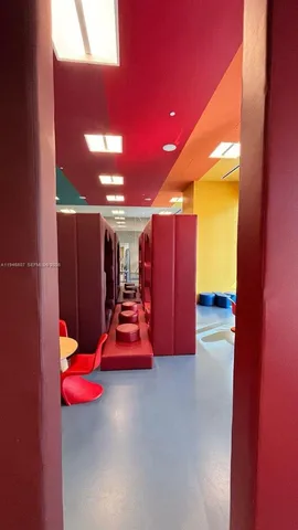 a room with gym equipment and a large window