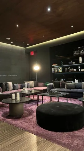 a view of a swimming pool with outdoor seating