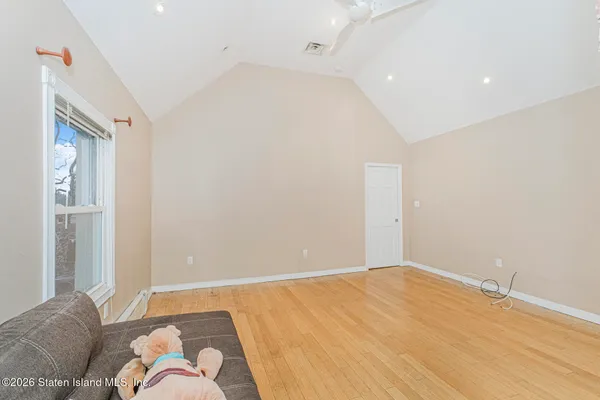 a bedroom with a bed and with furniture