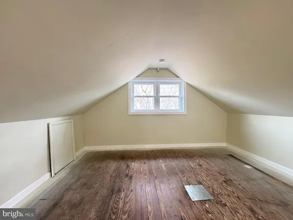a bathroom with a sink a toilet a window and vanity