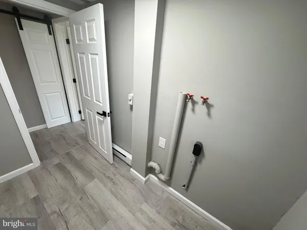 a view of a hallway with a room