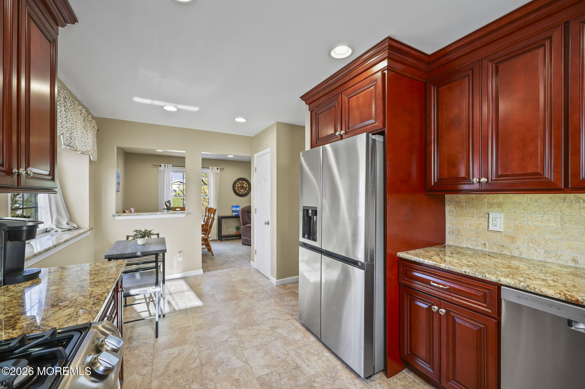 48 Hedgewood Road Howell, NJ 07731 - Photo 11 of 46 a kitchen with stainless steel appliances granite countertop a refrigerator and a sink