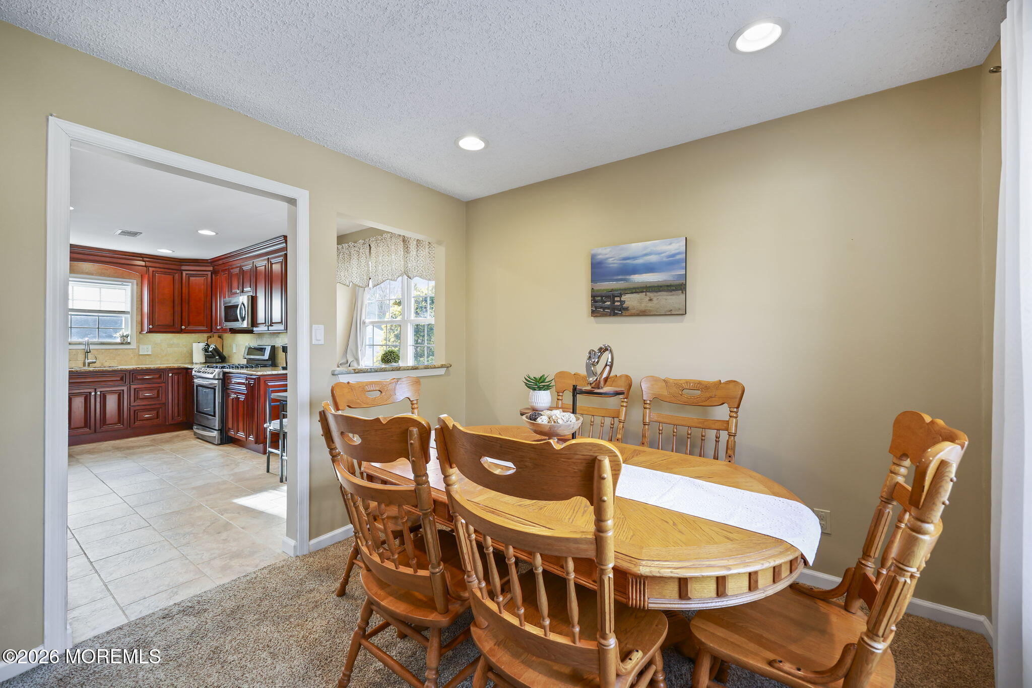 48 Hedgewood Road Howell, NJ 07731 - Photo 13 of 46 a view of a dining room with furniture and a kitchen
