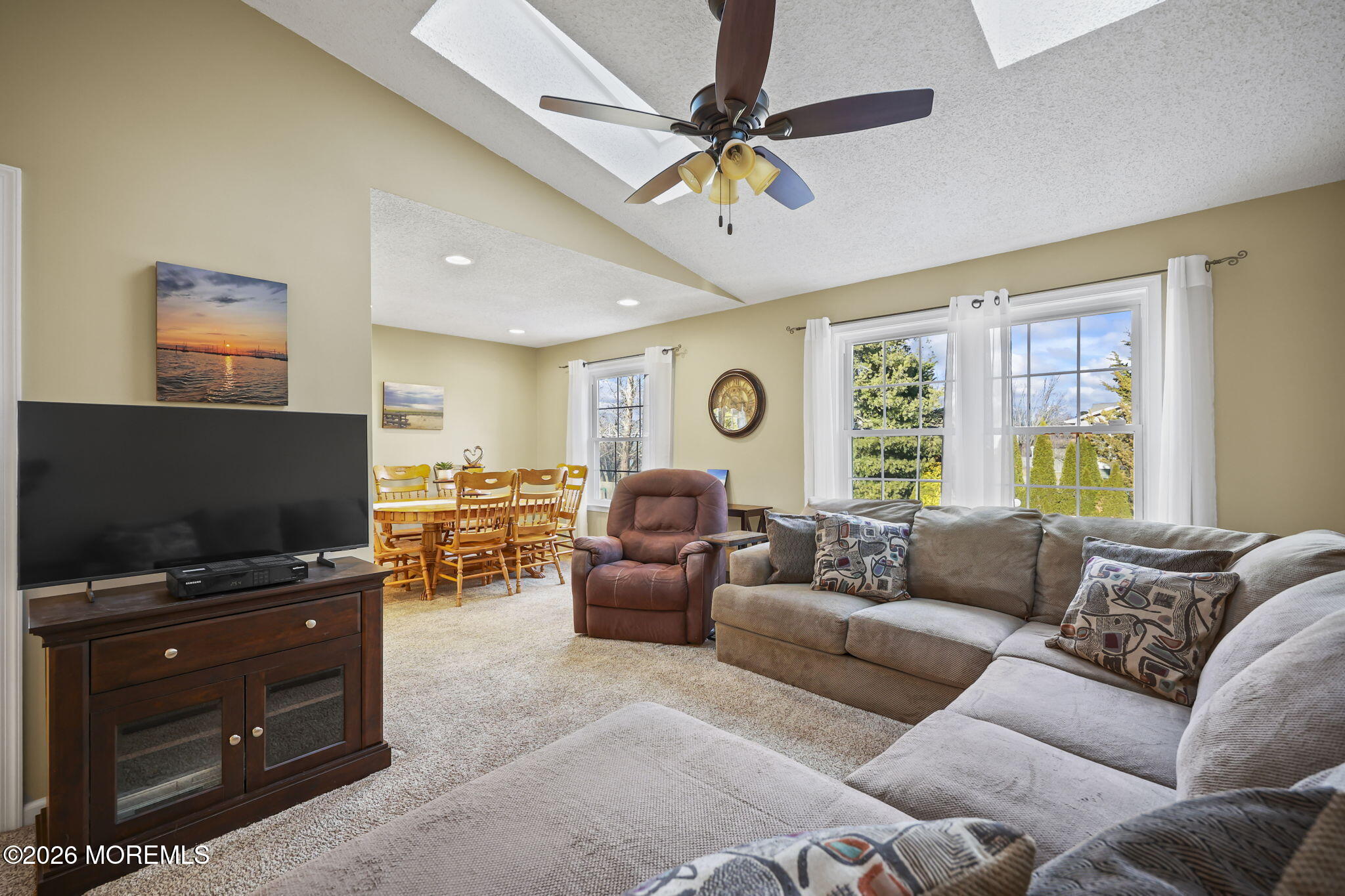 48 Hedgewood Road Howell, NJ 07731 - Photo 18 of 46 a living room with furniture and a flat screen tv