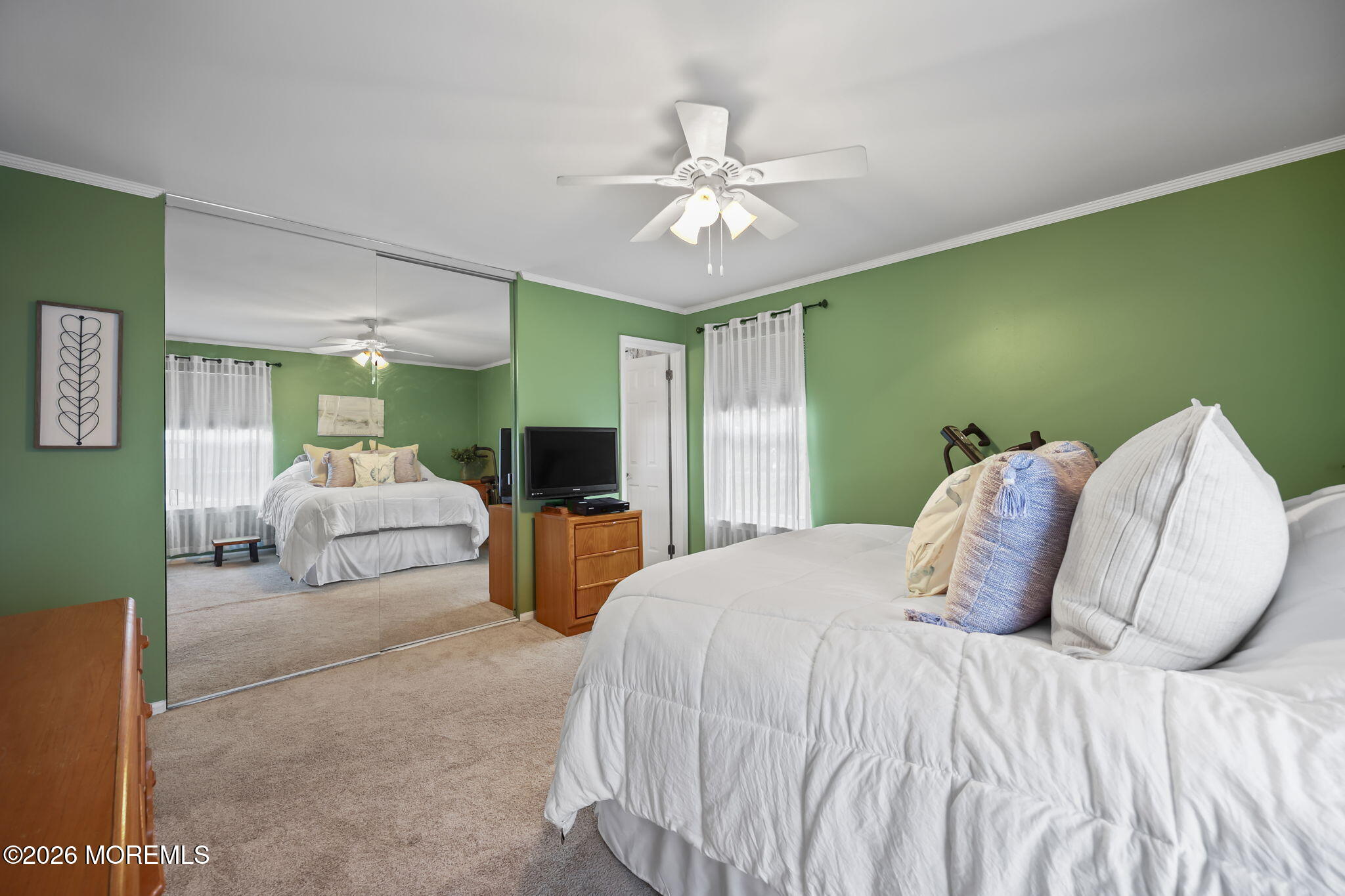 48 Hedgewood Road Howell, NJ 07731 - Photo 25 of 46 a bedroom with a large bed and ceiling fan