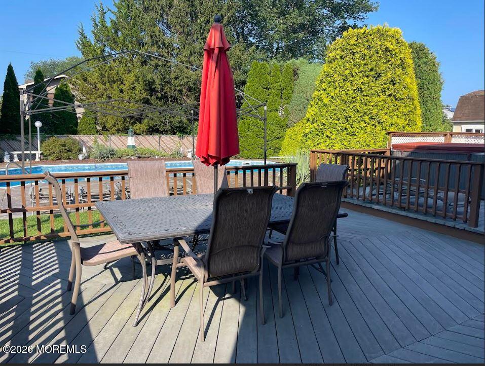 48 Hedgewood Road Howell, NJ 07731 - Photo 34 of 46 a view of a chairs and table on the deck