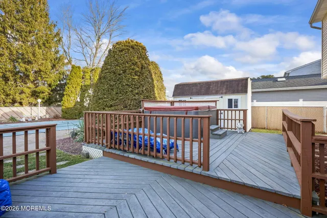 a view of balcony with wooden floor