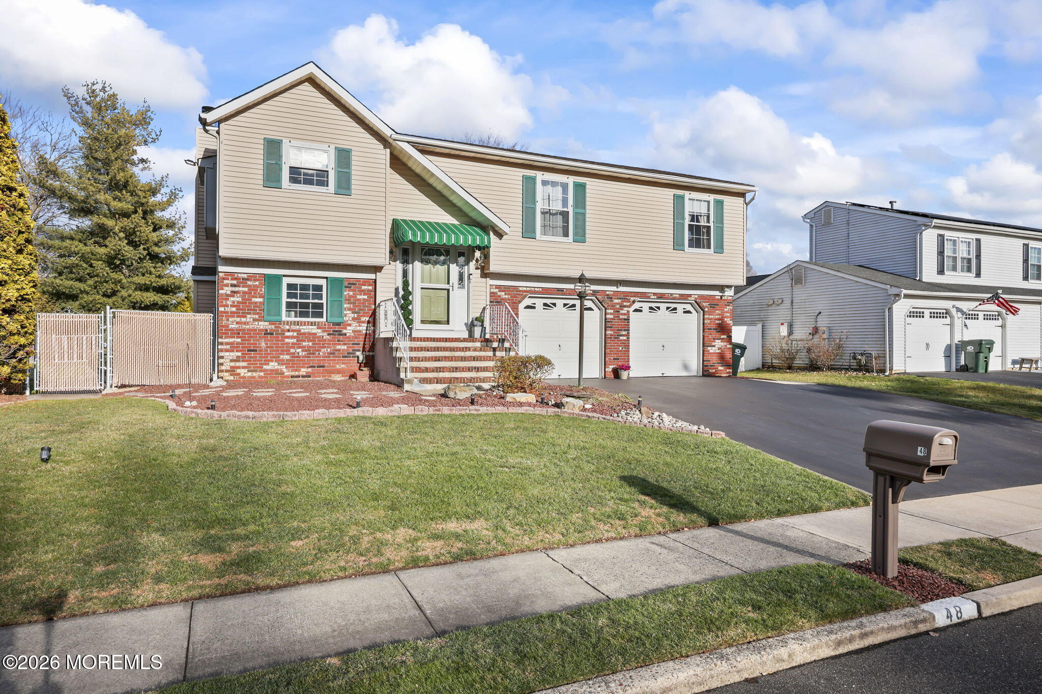 48 Hedgewood Road Howell, NJ 07731 - Photo 4 of 46 a front view of a house with a yard