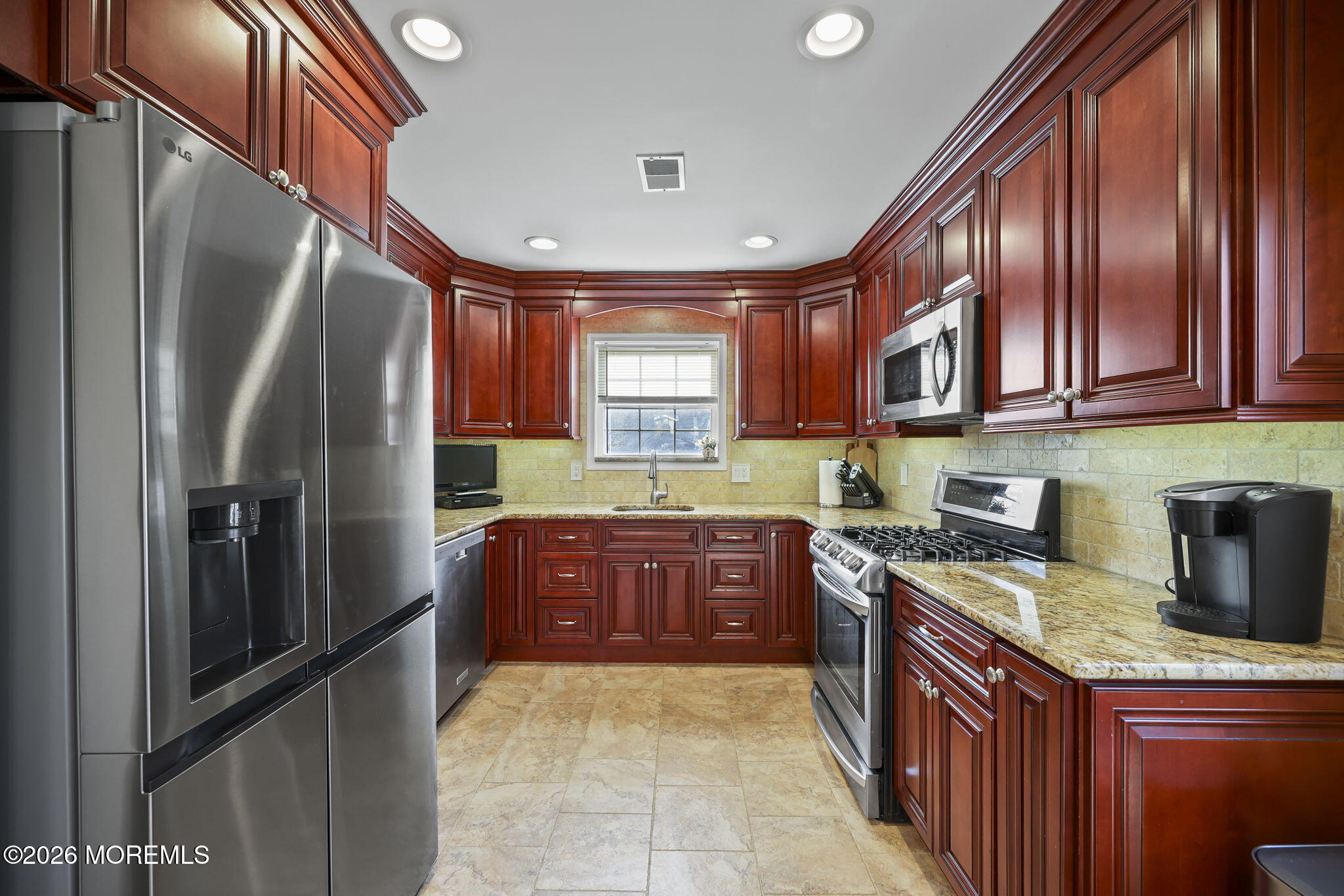 48 Hedgewood Road Howell, NJ 07731 - Photo 9 of 46 a kitchen with stainless steel appliances granite countertop a refrigerator a stove a sink and dishwasher