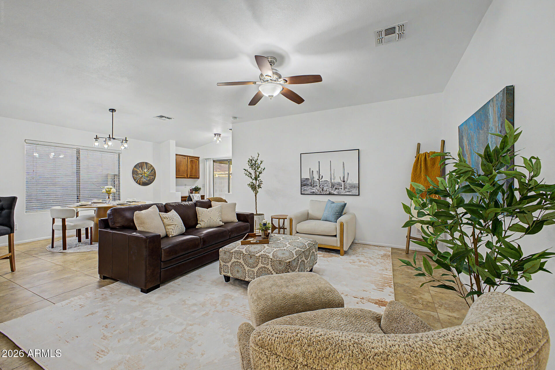 4168 East Sandy Way Gilbert, AZ 85297 - Photo 4 of 47 a living room with furniture and a chandelier